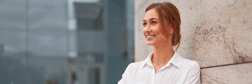 Woman leaning against wall