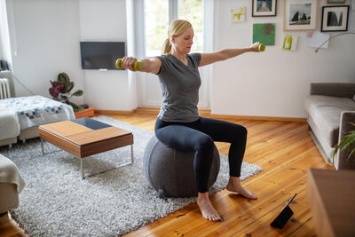 Woman on medicine ball