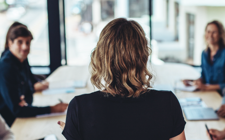 woman in front of colleagues
