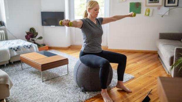 Woman on medicine ball
