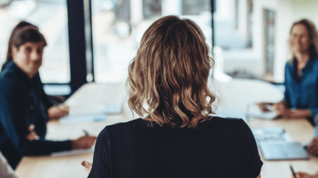 woman in front of colleagues