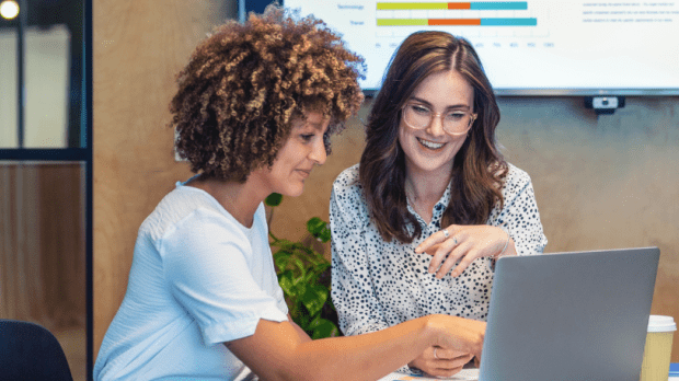 Two people on a computer